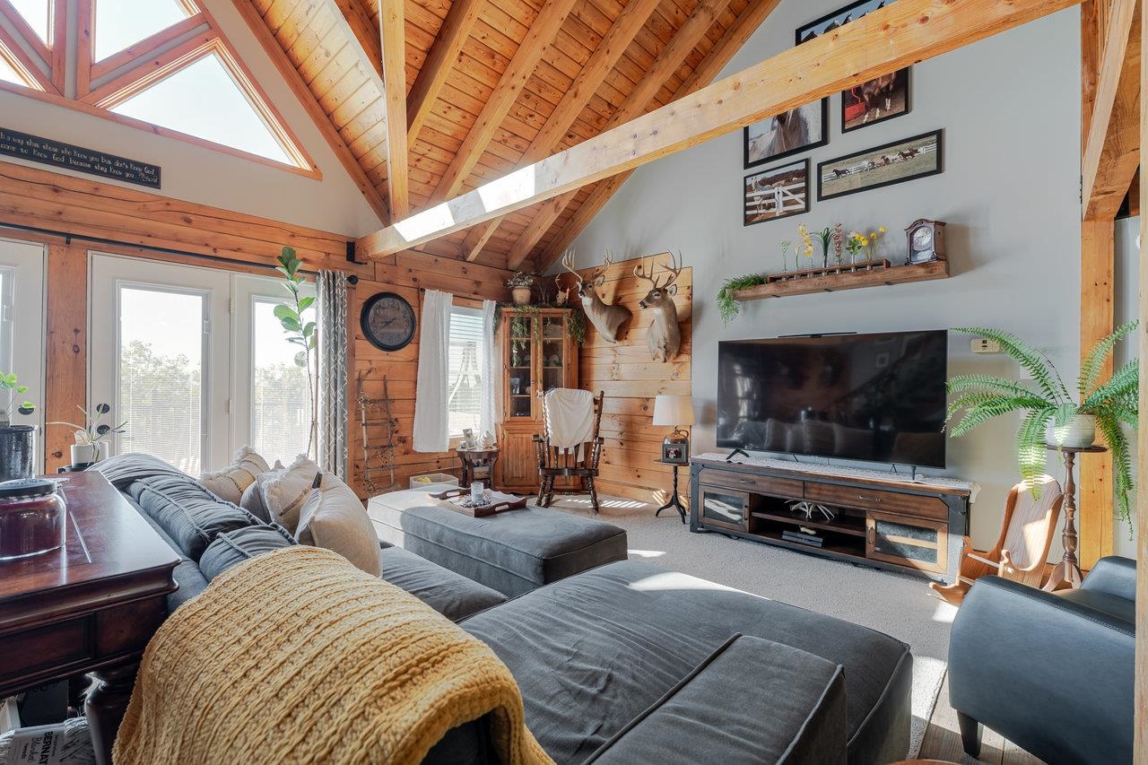 12012 Hollar School Road Linville, VA 22834 - Photo 34 of 75 a living room with furniture and a flat screen tv