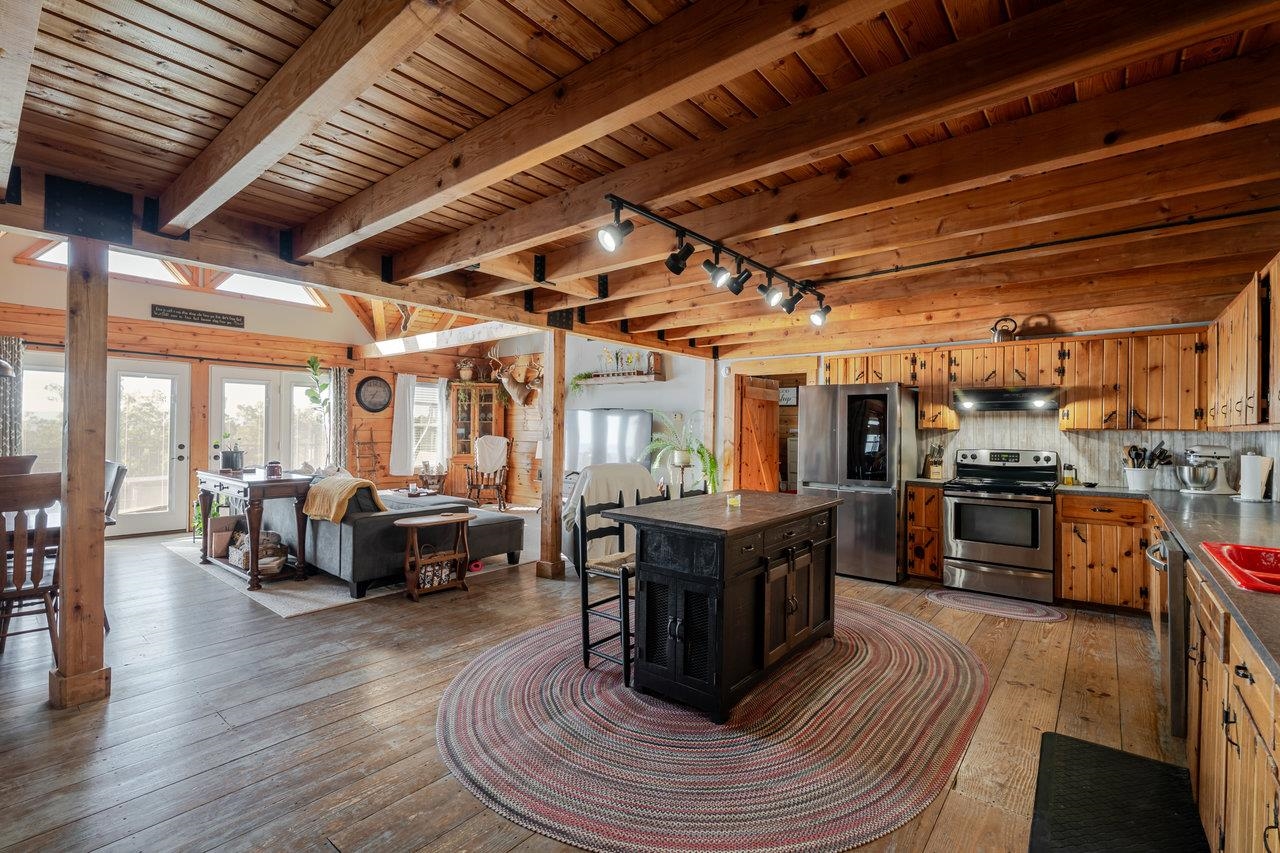 12012 Hollar School Road Linville, VA 22834 - Photo 38 of 75 a living room with lots of furniture and kitchen view