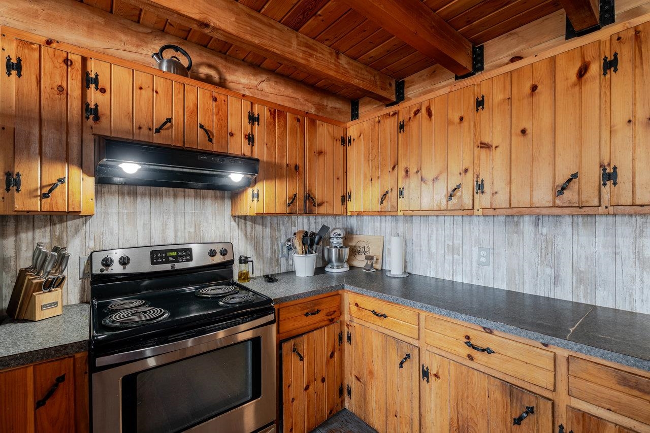 12012 Hollar School Road Linville, VA 22834 - Photo 40 of 75 a kitchen with stainless steel appliances granite countertop a stove and a sink