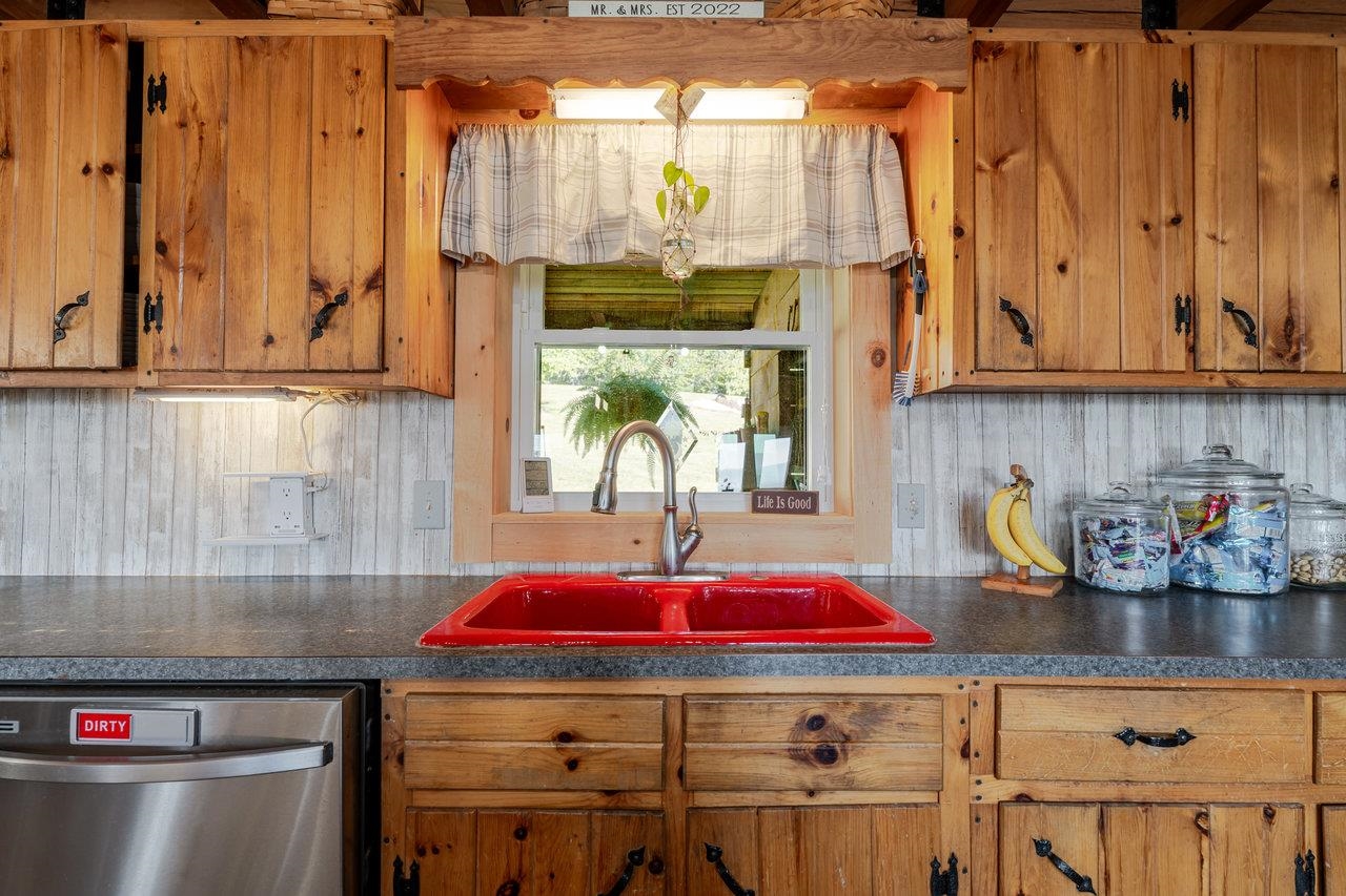 12012 Hollar School Road Linville, VA 22834 - Photo 41 of 75 a kitchen with a sink and a stove top oven