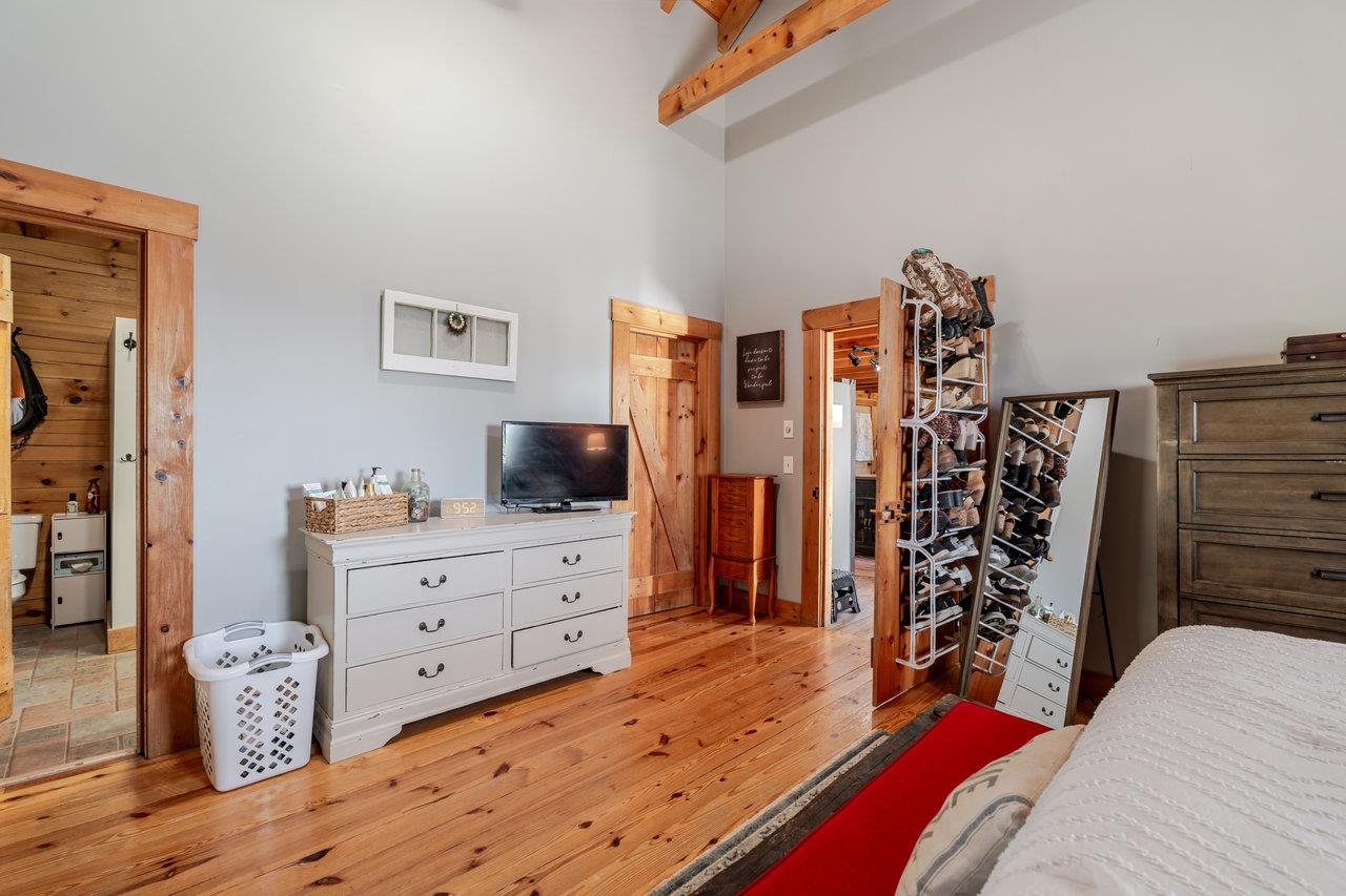 12012 Hollar School Road Linville, VA 22834 - Photo 47 of 75 a bedroom with a bed and a flat tv screen