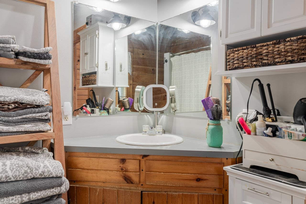 12012 Hollar School Road Linville, VA 22834 - Photo 49 of 75 a bathroom with a sink and a mirror