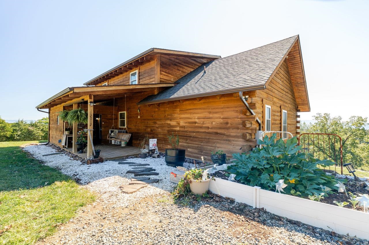 12012 Hollar School Road Linville, VA 22834 - Photo 5 of 75 a view of a house with backyard and sitting area