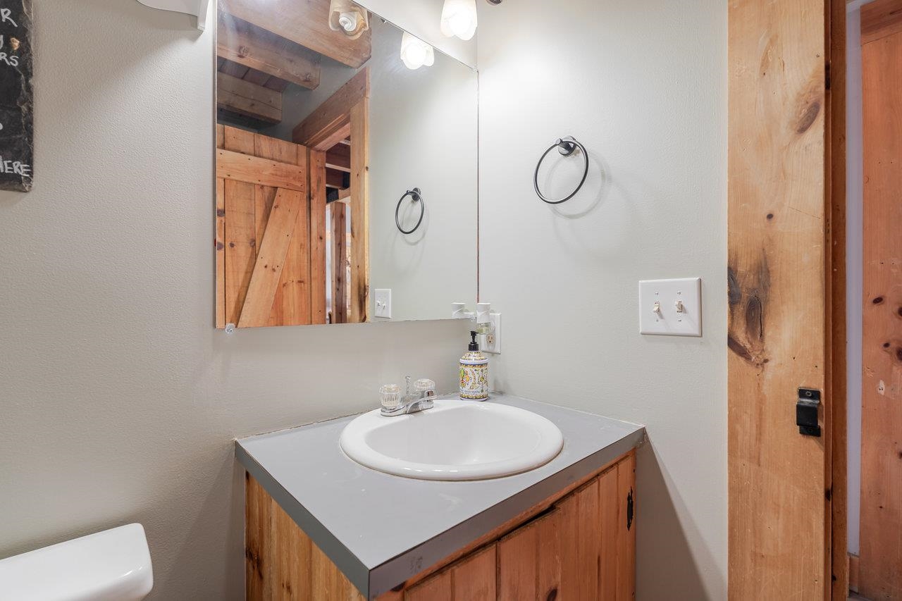 12012 Hollar School Road Linville, VA 22834 - Photo 52 of 75 a bathroom with a sink vanity and a mirror