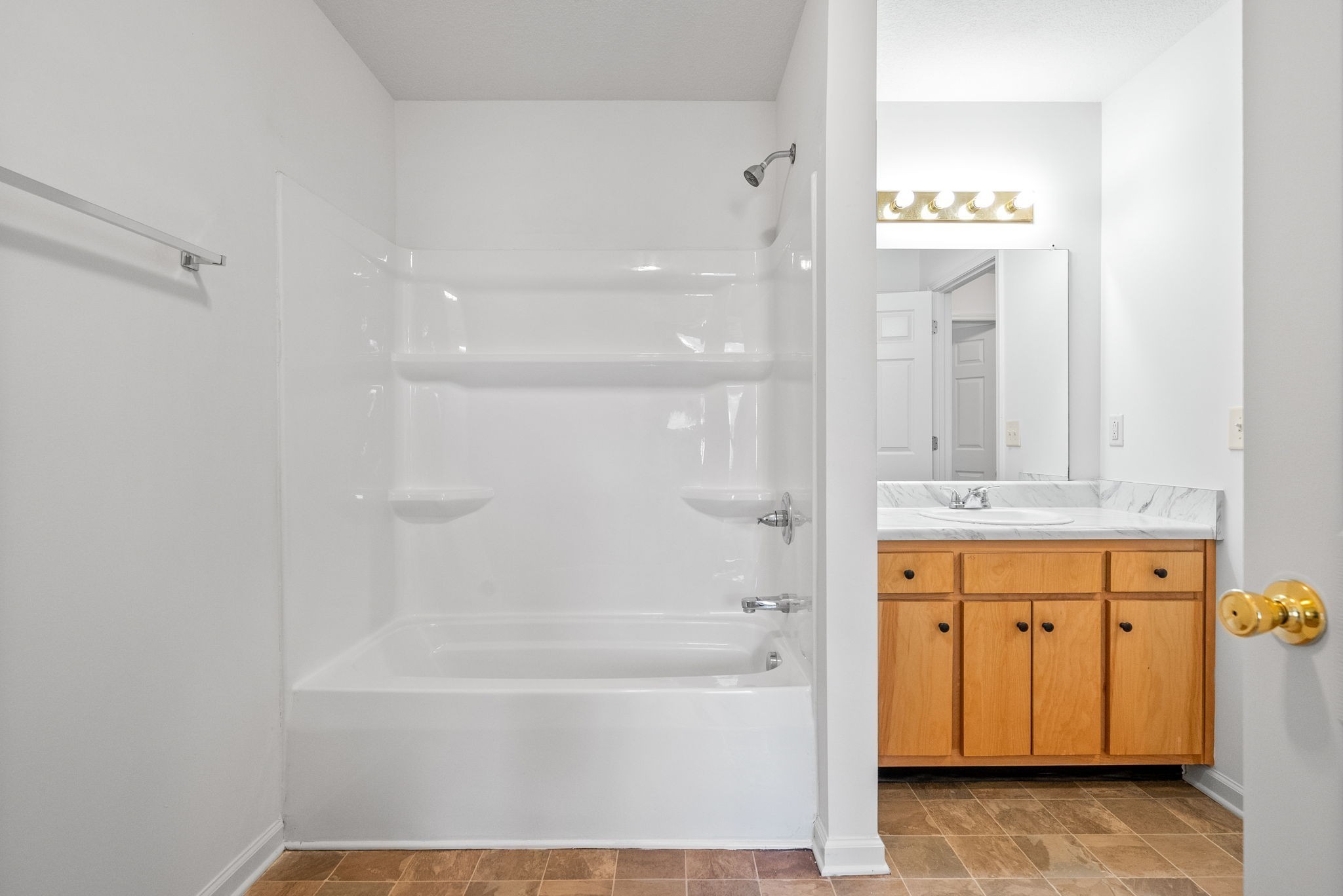 512 Peachers Ridge Road, Unit 3A Clarksville, TN 37042 - Photo 11 of 15 a bathroom with a tub shower and sink