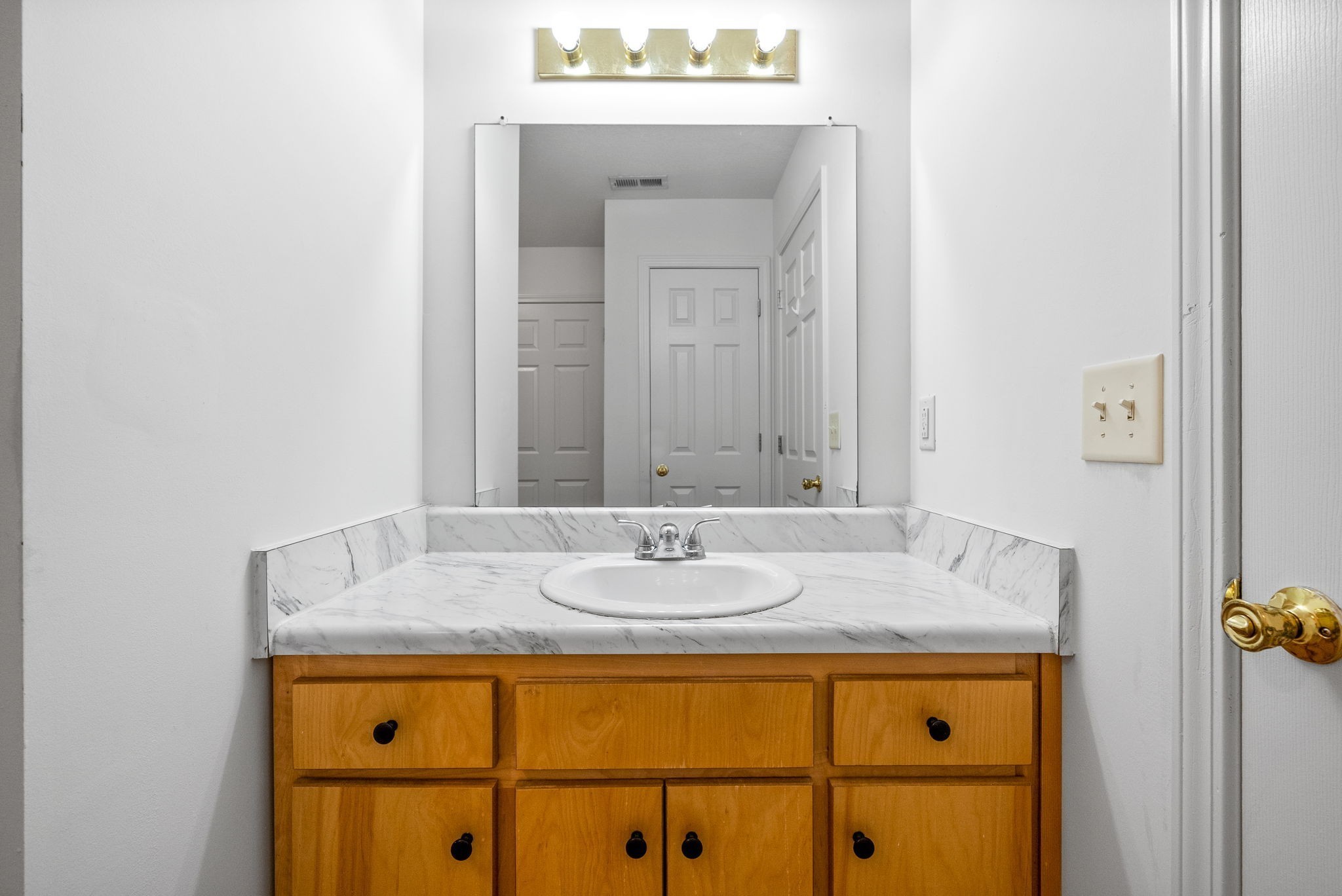 512 Peachers Ridge Road, Unit 3A Clarksville, TN 37042 - Photo 12 of 15 a bathroom with a sink and a mirror