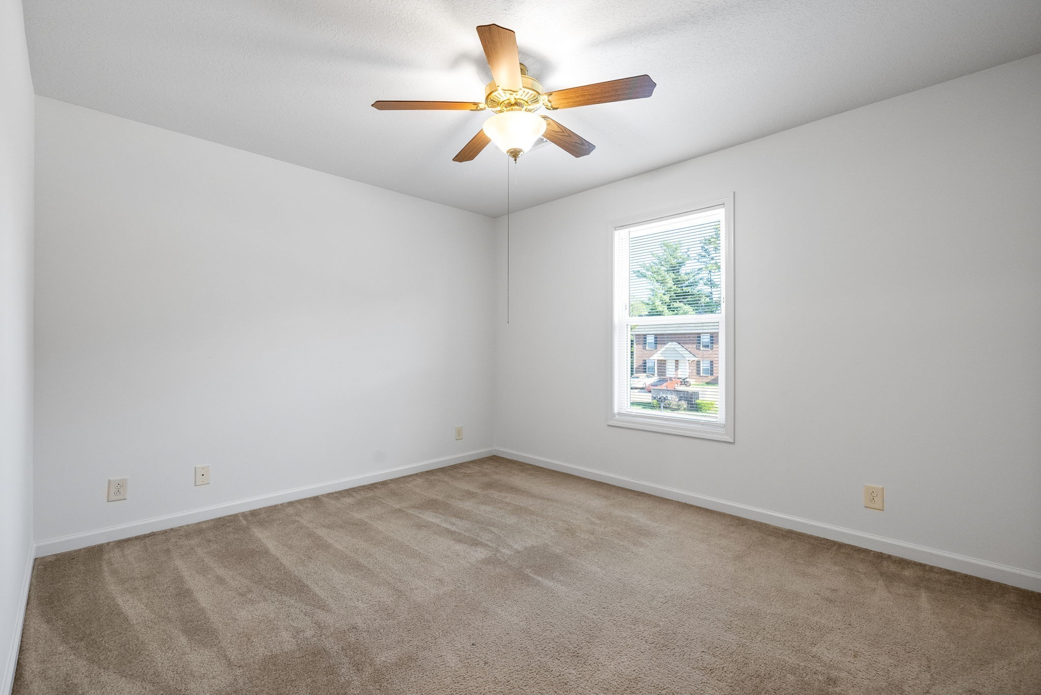 512 Peachers Ridge Road, Unit 3A Clarksville, TN 37042 - Photo 13 of 15 an empty room with windows and chandelier fan