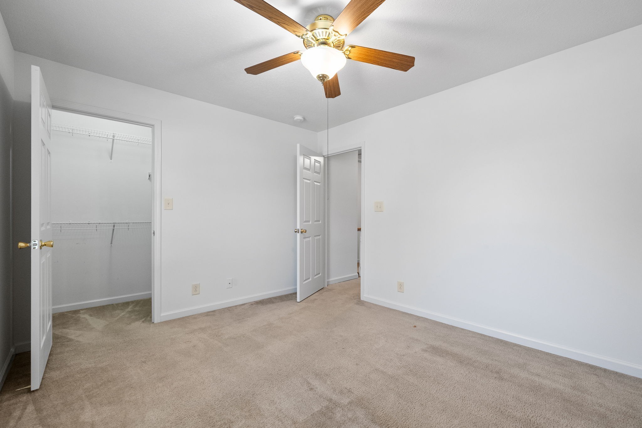 512 Peachers Ridge Road, Unit 3A Clarksville, TN 37042 - Photo 14 of 15 an empty room with closet and a chandelier fan