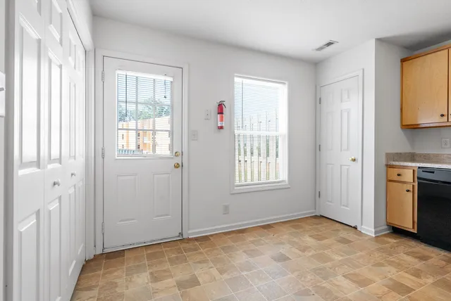 a view of an empty room with a window