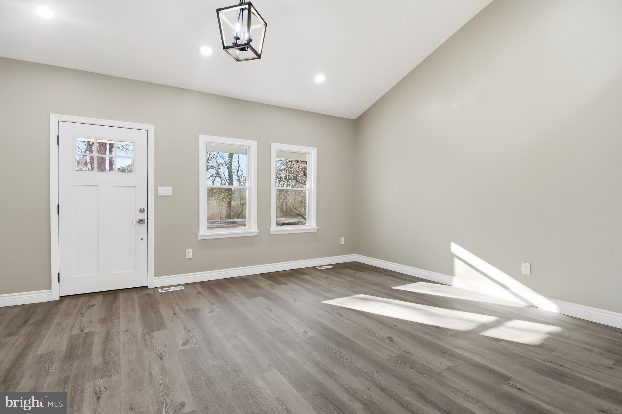 62 Grassy Lake Road Shamong, NJ 08088 - Photo 11 of 25 a view of an empty room with wooden floor and a window