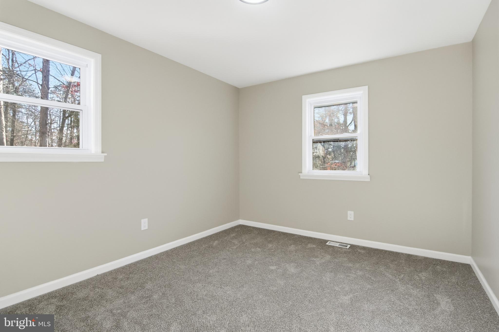 62 Grassy Lake Road Shamong, NJ 08088 - Photo 16 of 25 an empty room with windows
