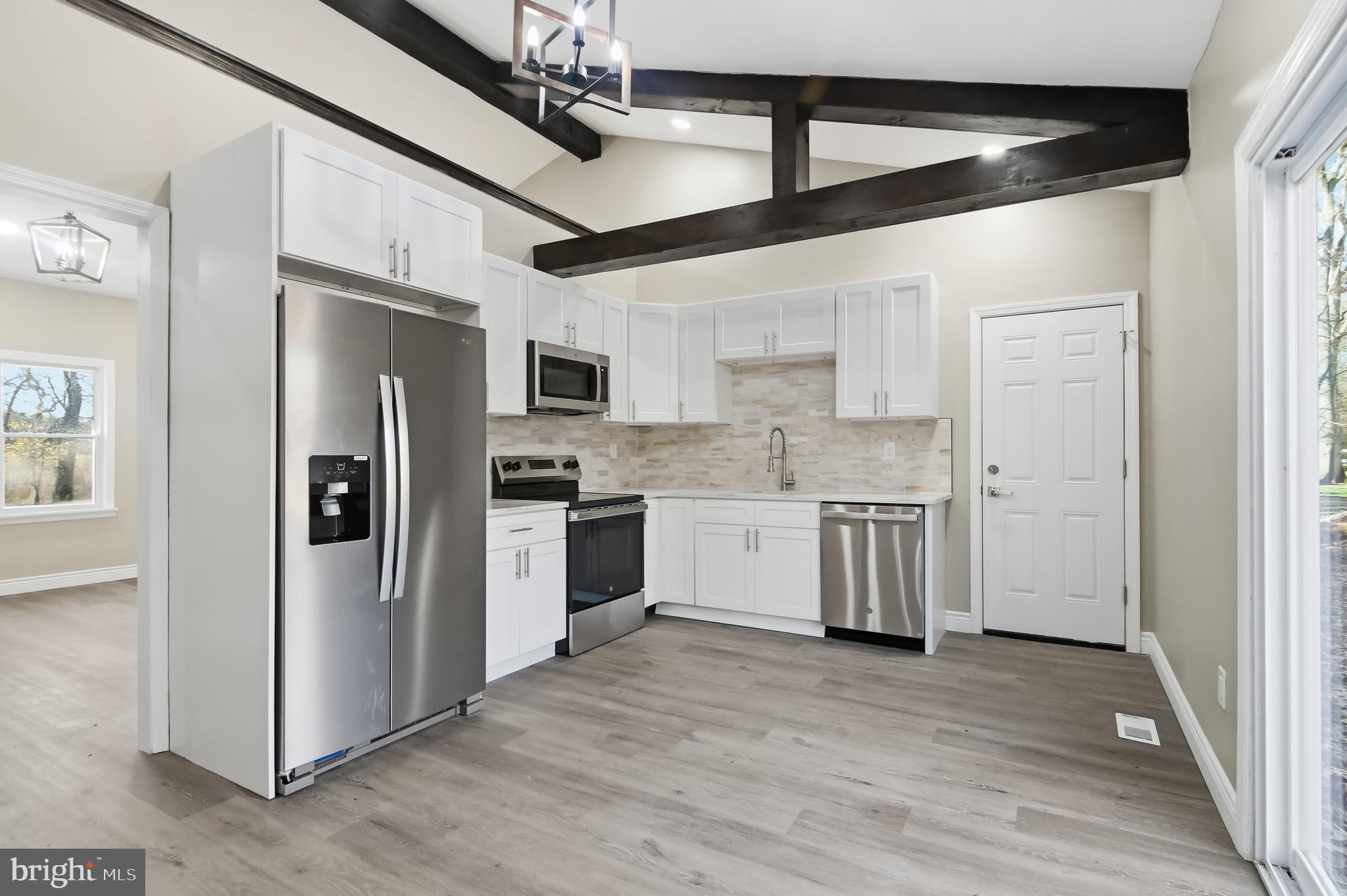 62 Grassy Lake Road Shamong, NJ 08088 - Photo 3 of 25 a kitchen with a refrigerator a sink and dishwasher