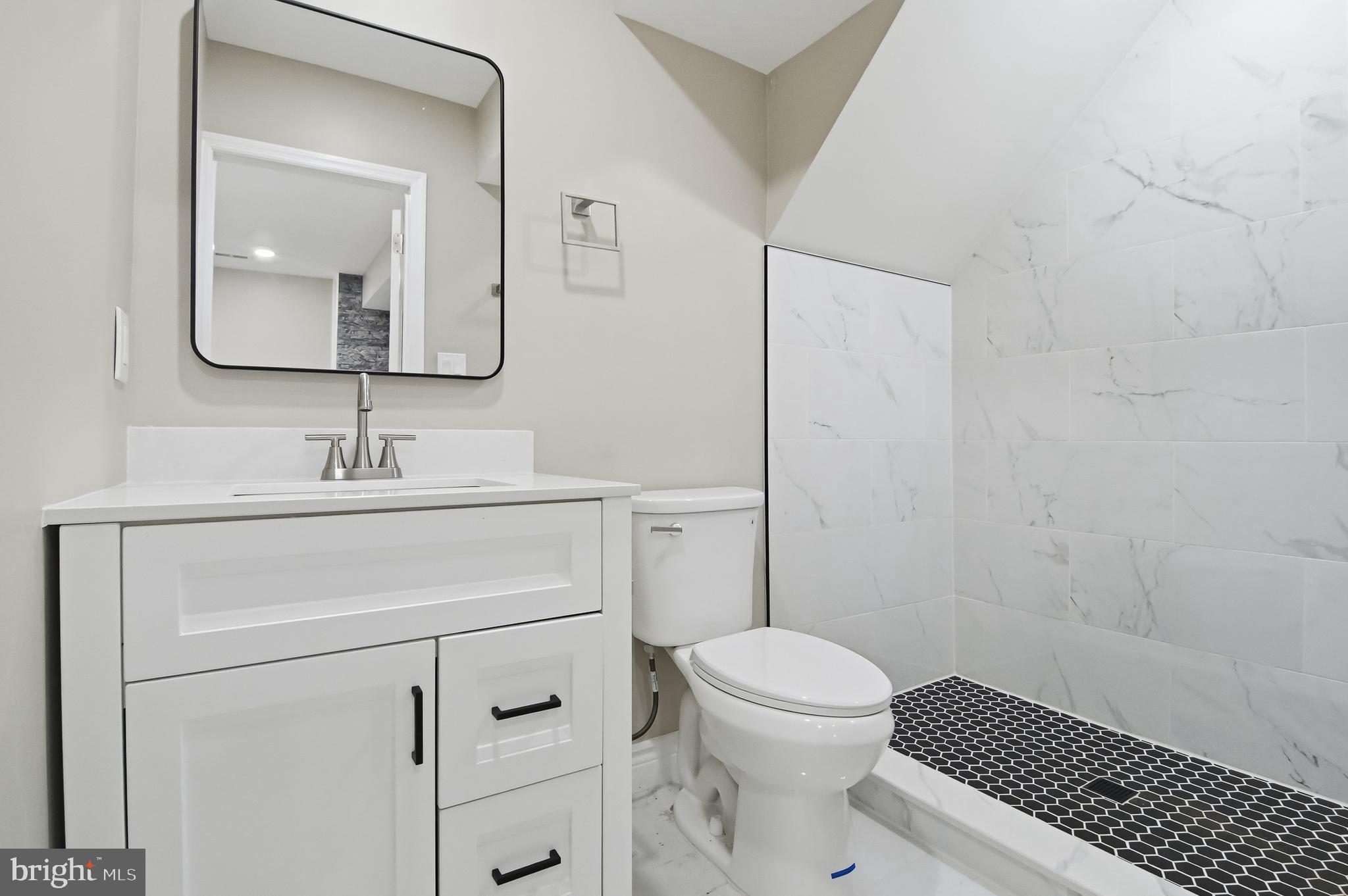 62 Grassy Lake Road Shamong, NJ 08088 - Photo 5 of 25 a bathroom with a sink toilet vanity and shower