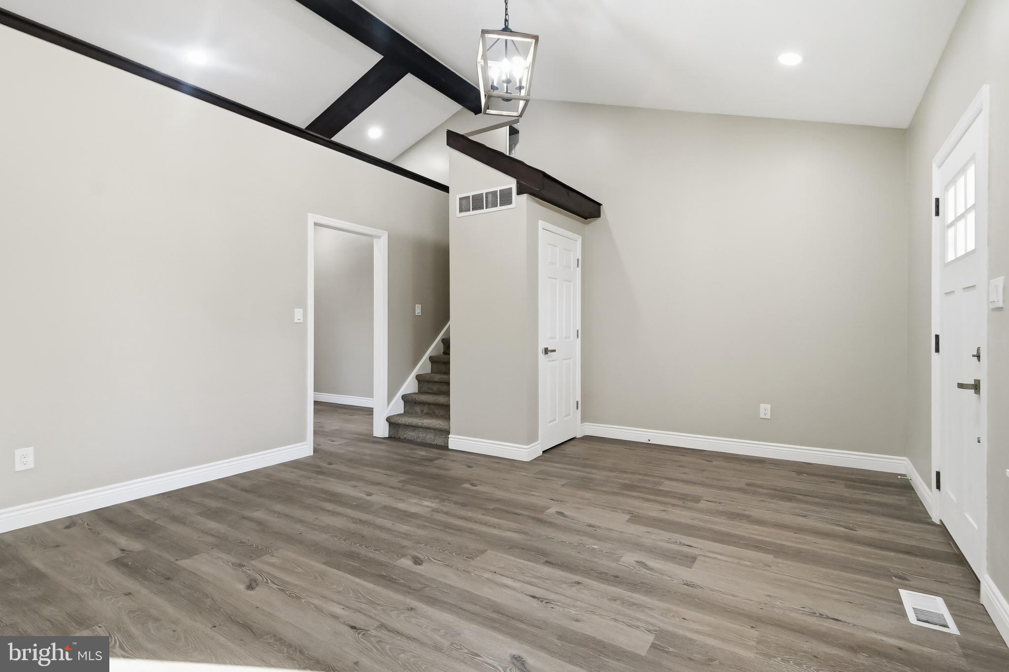 62 Grassy Lake Road Shamong, NJ 08088 - Photo 10 of 25 a view of an empty room with wooden floor and a window