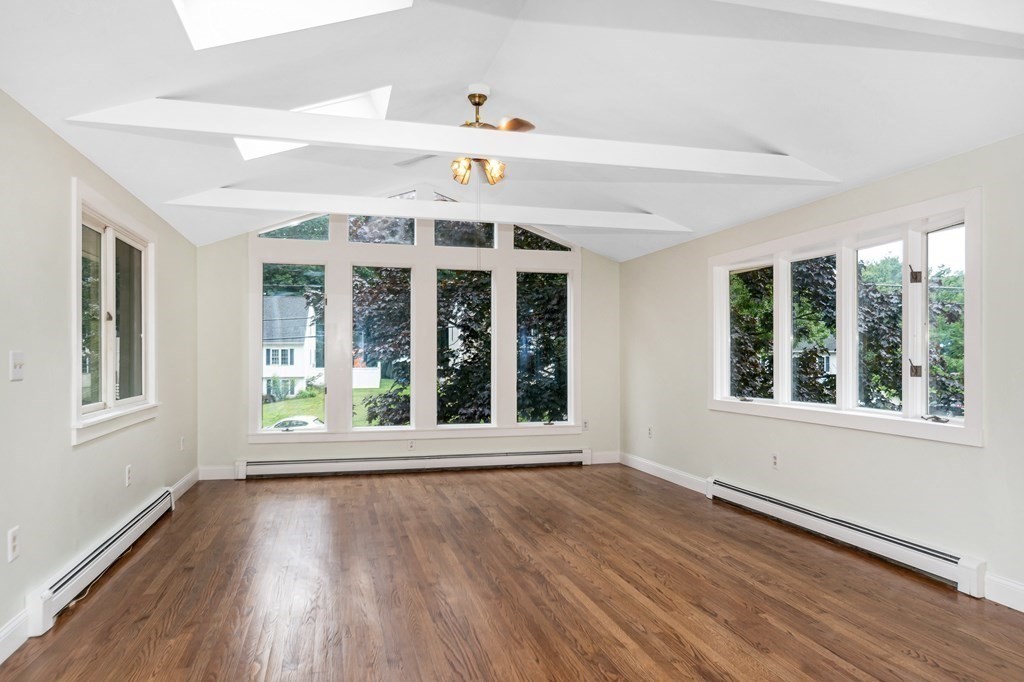 49 Parham Road Tyngsborough, MA 01879 - Photo 11 of 31 a view of an empty room with wooden floor and a window