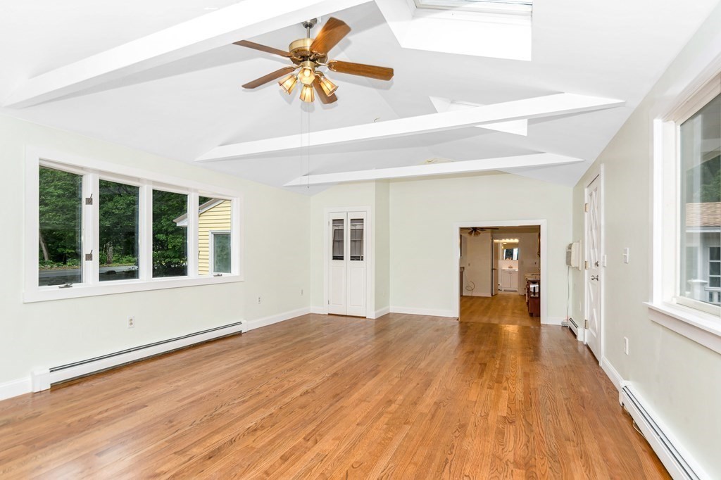 49 Parham Road Tyngsborough, MA 01879 - Photo 12 of 31 a view of an empty room with wooden floor and a window