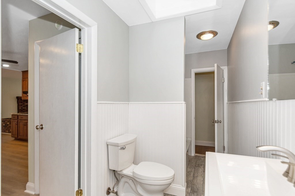 49 Parham Road Tyngsborough, MA 01879 - Photo 13 of 31 a bathroom with a toilet and a sink
