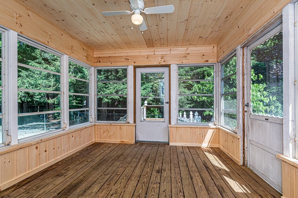 49 Parham Road Tyngsborough, MA 01879 - Photo 14 of 31 a view of a room with wooden floor and outdoor view
