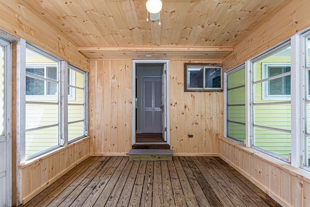 49 Parham Road Tyngsborough, MA 01879 - Photo 15 of 31 a view of a porch with wooden floor and fence