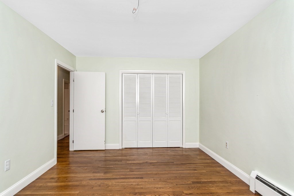 49 Parham Road Tyngsborough, MA 01879 - Photo 17 of 31 a view of an empty room with wooden floor