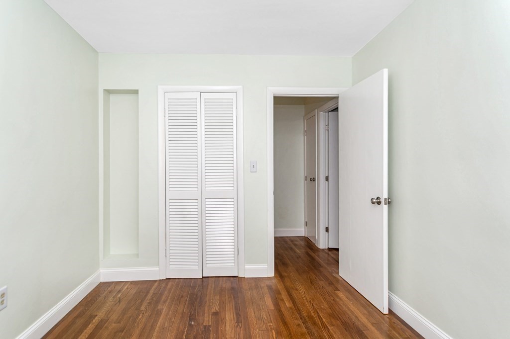 49 Parham Road Tyngsborough, MA 01879 - Photo 19 of 31 an empty room with wooden floor and a window