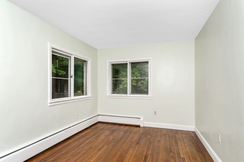 49 Parham Road Tyngsborough, MA 01879 - Photo 20 of 31 an empty room with wooden floor and windows