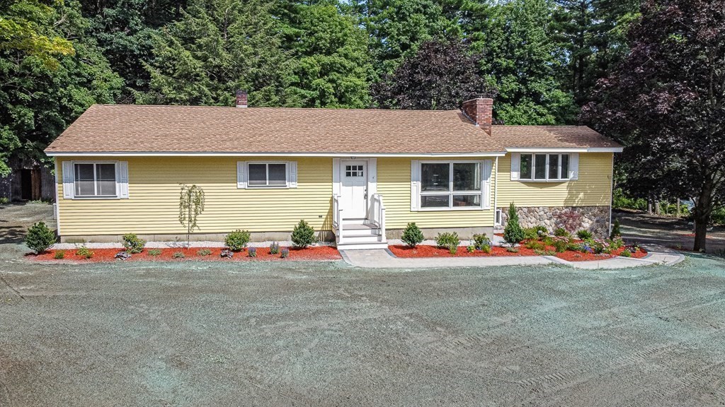 49 Parham Road Tyngsborough, MA 01879 - Photo 2 of 31 a front view of a house with an outdoor space