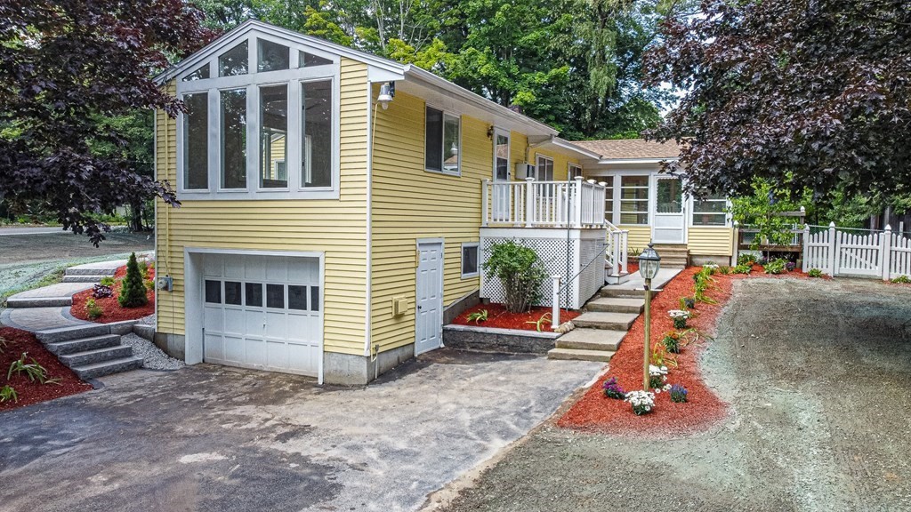 49 Parham Road Tyngsborough, MA 01879 - Photo 26 of 31 a front view of a house with a yard