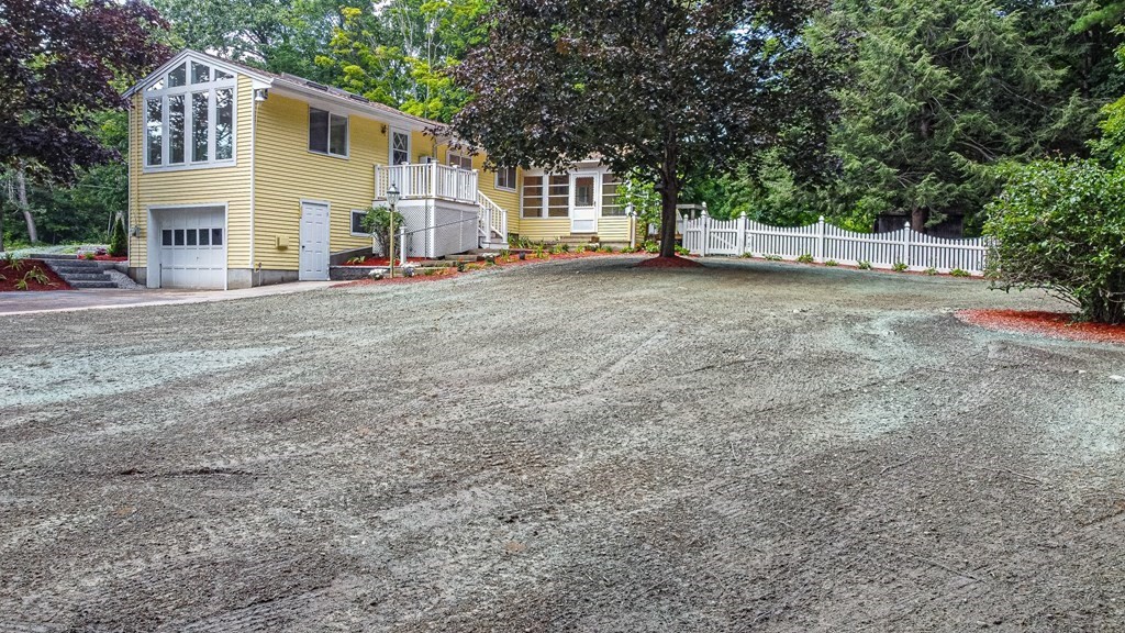 49 Parham Road Tyngsborough, MA 01879 - Photo 27 of 31 a view of a house with backyard and a tree