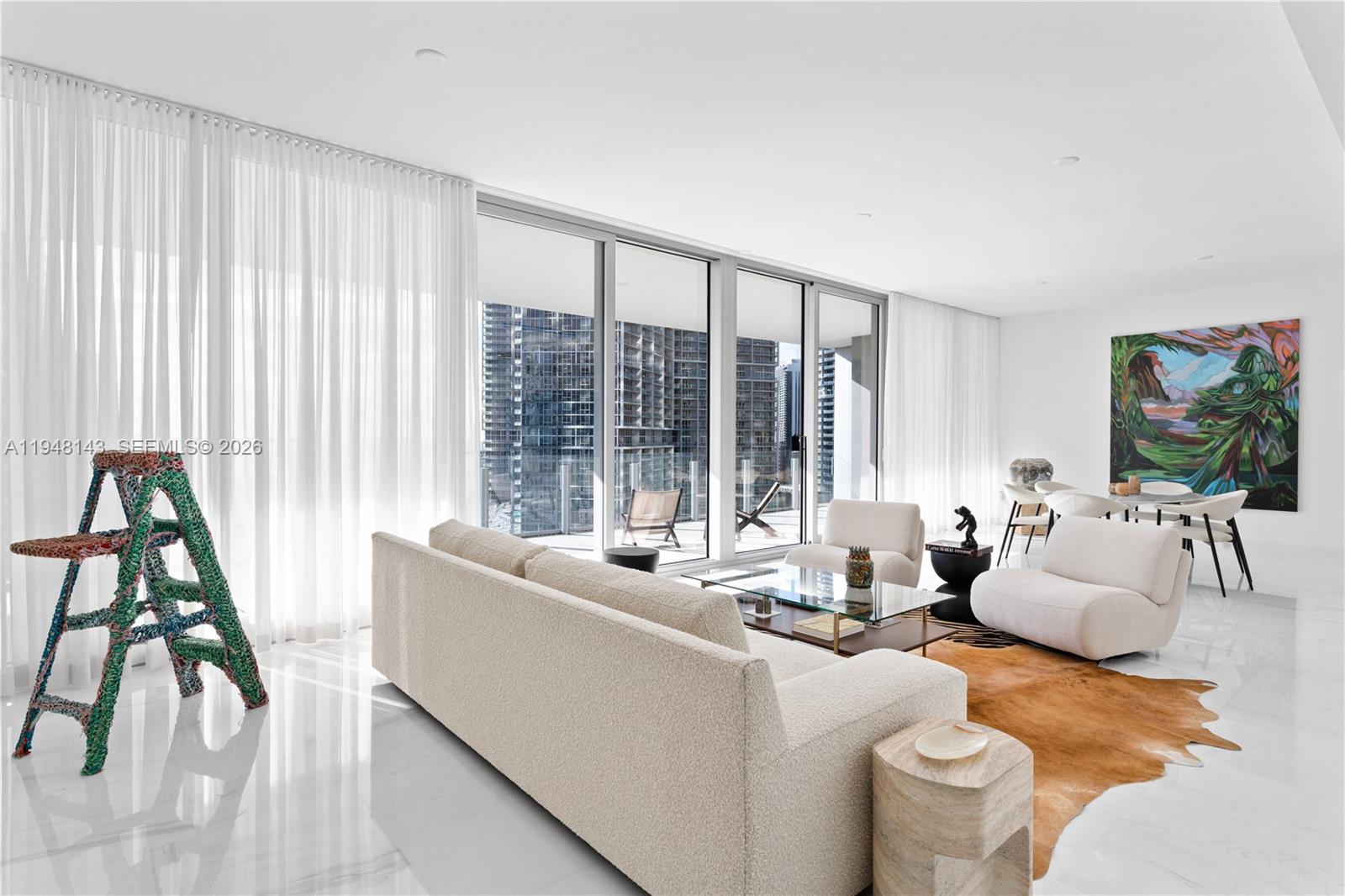 300 Biscayne Blvd Way, Unit 2102 Miami, FL 33131 - Photo 13 of 80 a living room with furniture and a large window