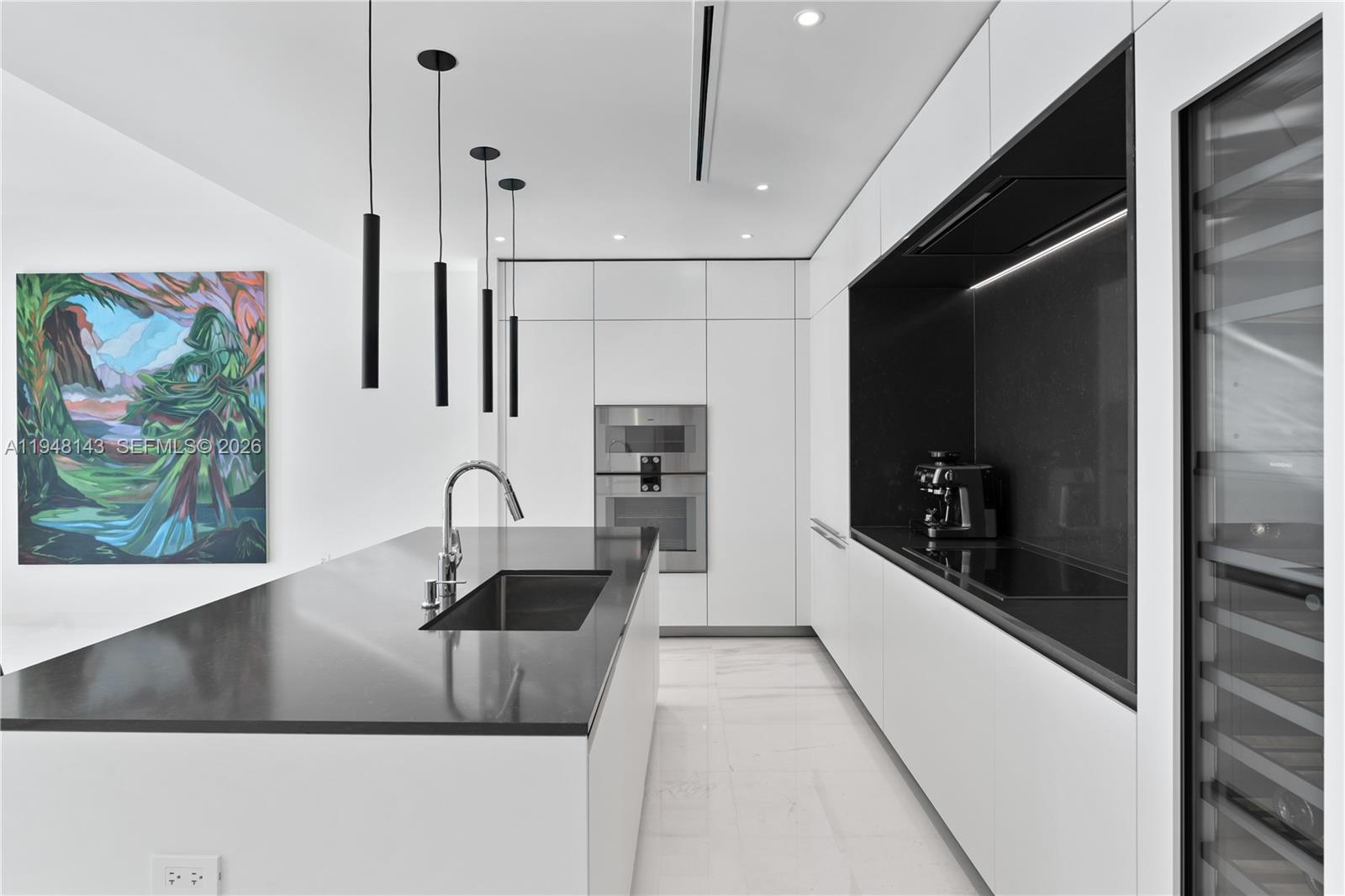 300 Biscayne Blvd Way, Unit 2102 Miami, FL 33131 - Photo 28 of 80 a kitchen with stainless steel appliances granite countertop a sink a stove and a refrigerator