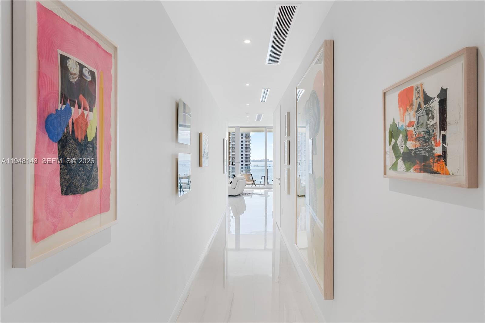 300 Biscayne Blvd Way, Unit 2102 Miami, FL 33131 - Photo 34 of 80 a view of a hallway with paintings on the wall
