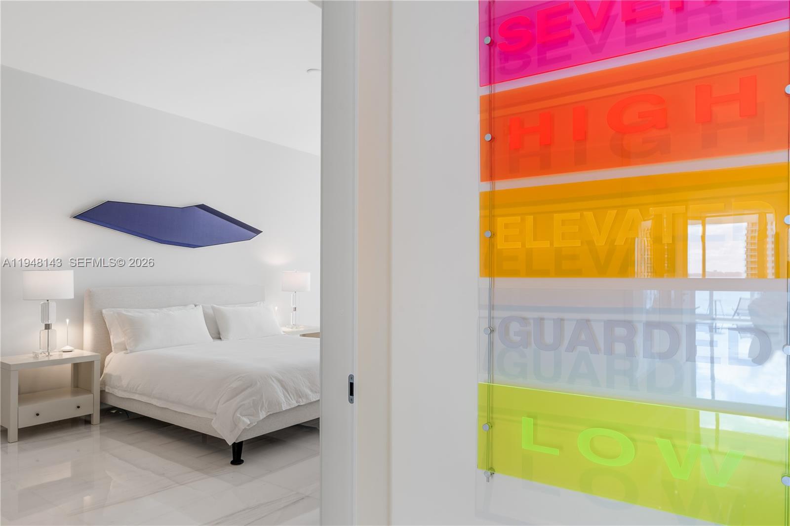 300 Biscayne Blvd Way, Unit 2102 Miami, FL 33131 - Photo 37 of 80 a bedroom with a bed and a view of kitchen