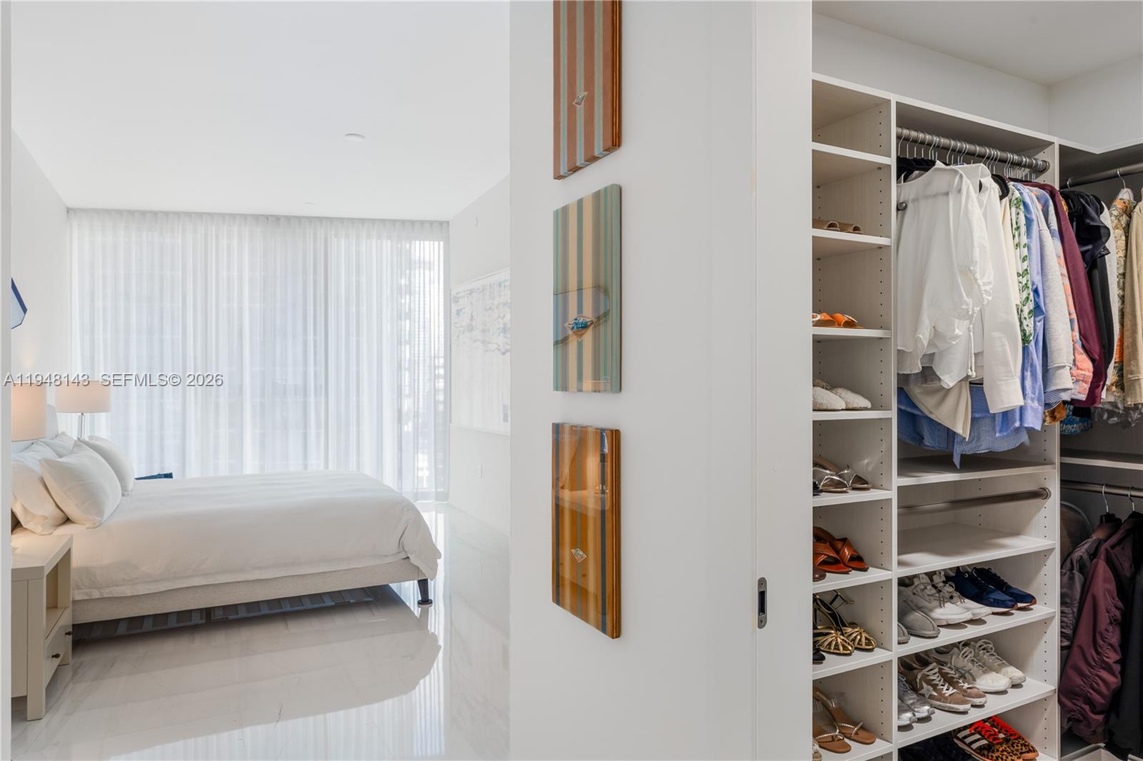 300 Biscayne Blvd Way, Unit 2102 Miami, FL 33131 - Photo 47 of 80 a bedroom with a bed and a window