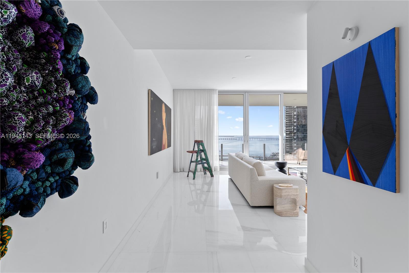 300 Biscayne Blvd Way, Unit 2102 Miami, FL 33131 - Photo 5 of 80 a living room with furniture and a large window