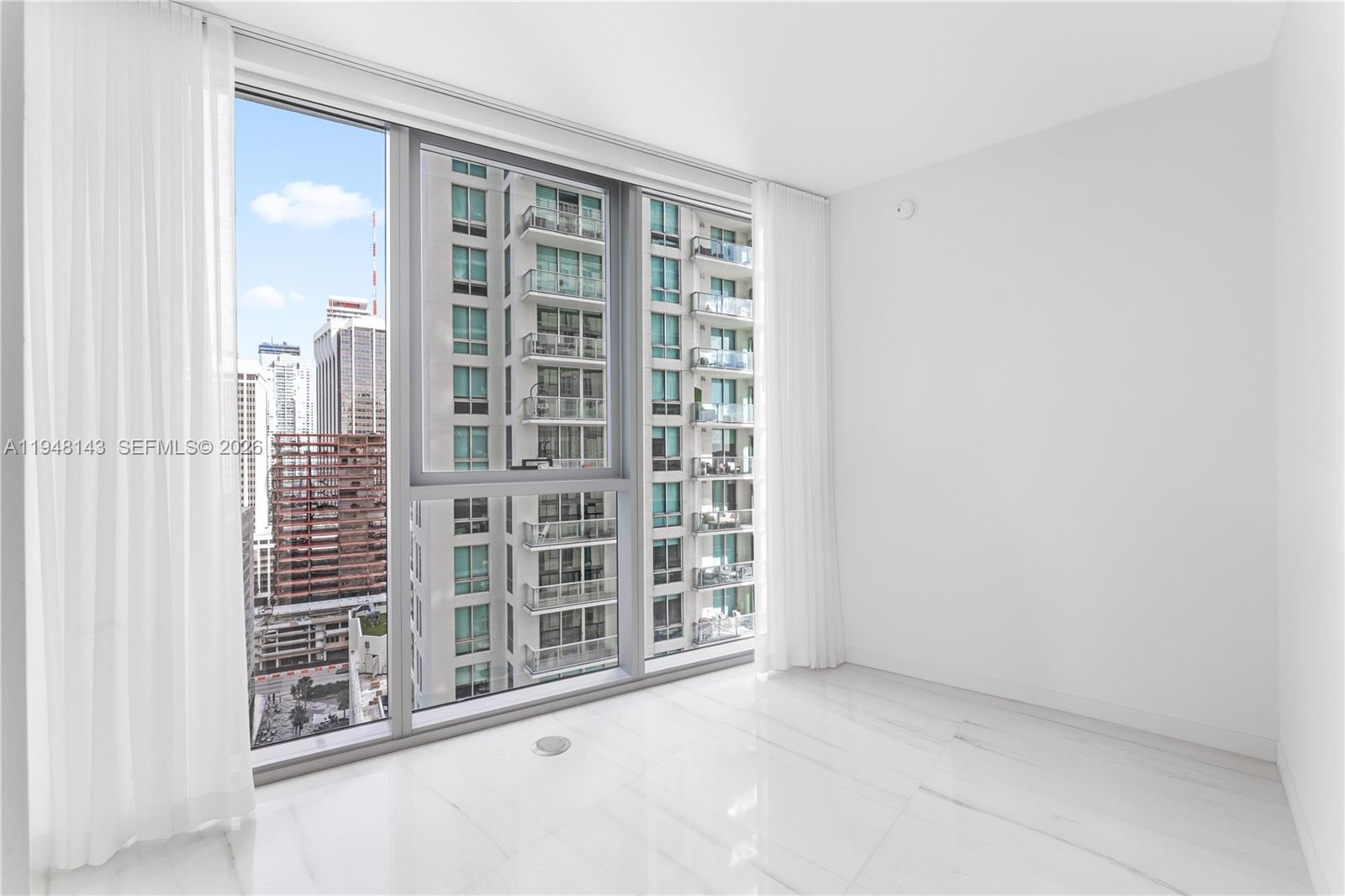 300 Biscayne Blvd Way, Unit 2102 Miami, FL 33131 - Photo 54 of 80 an empty room with windows