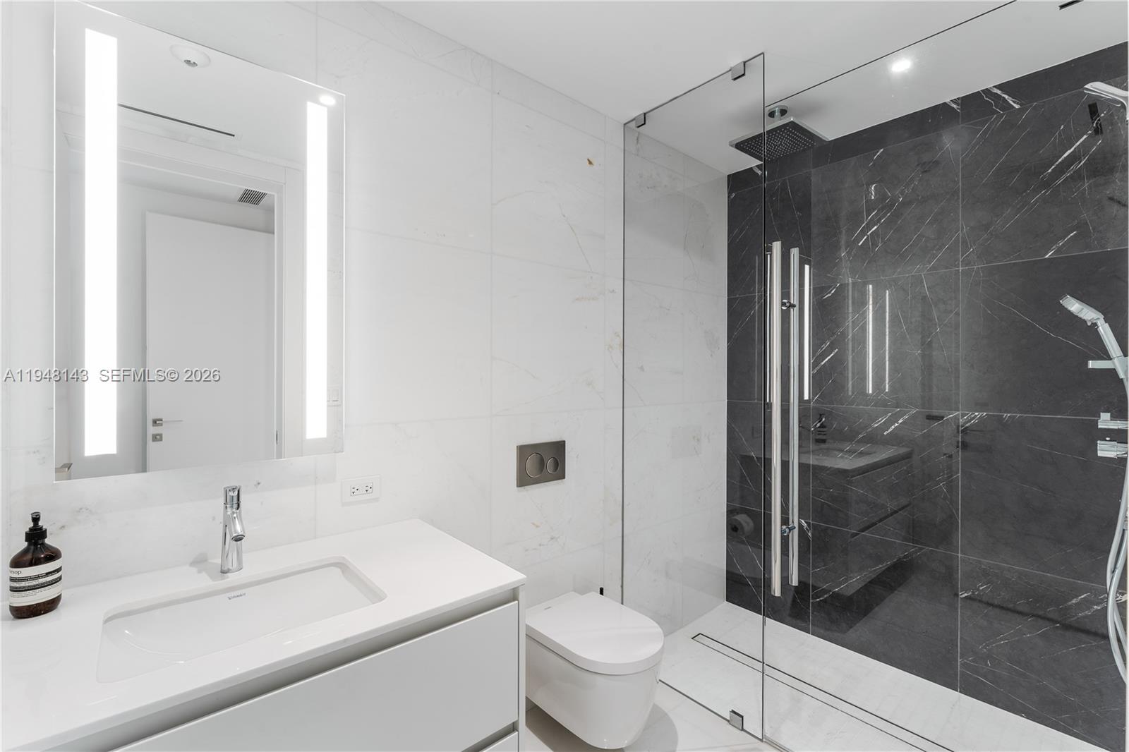 300 Biscayne Blvd Way, Unit 2102 Miami, FL 33131 - Photo 55 of 80 a bathroom with a sink toilet and shower