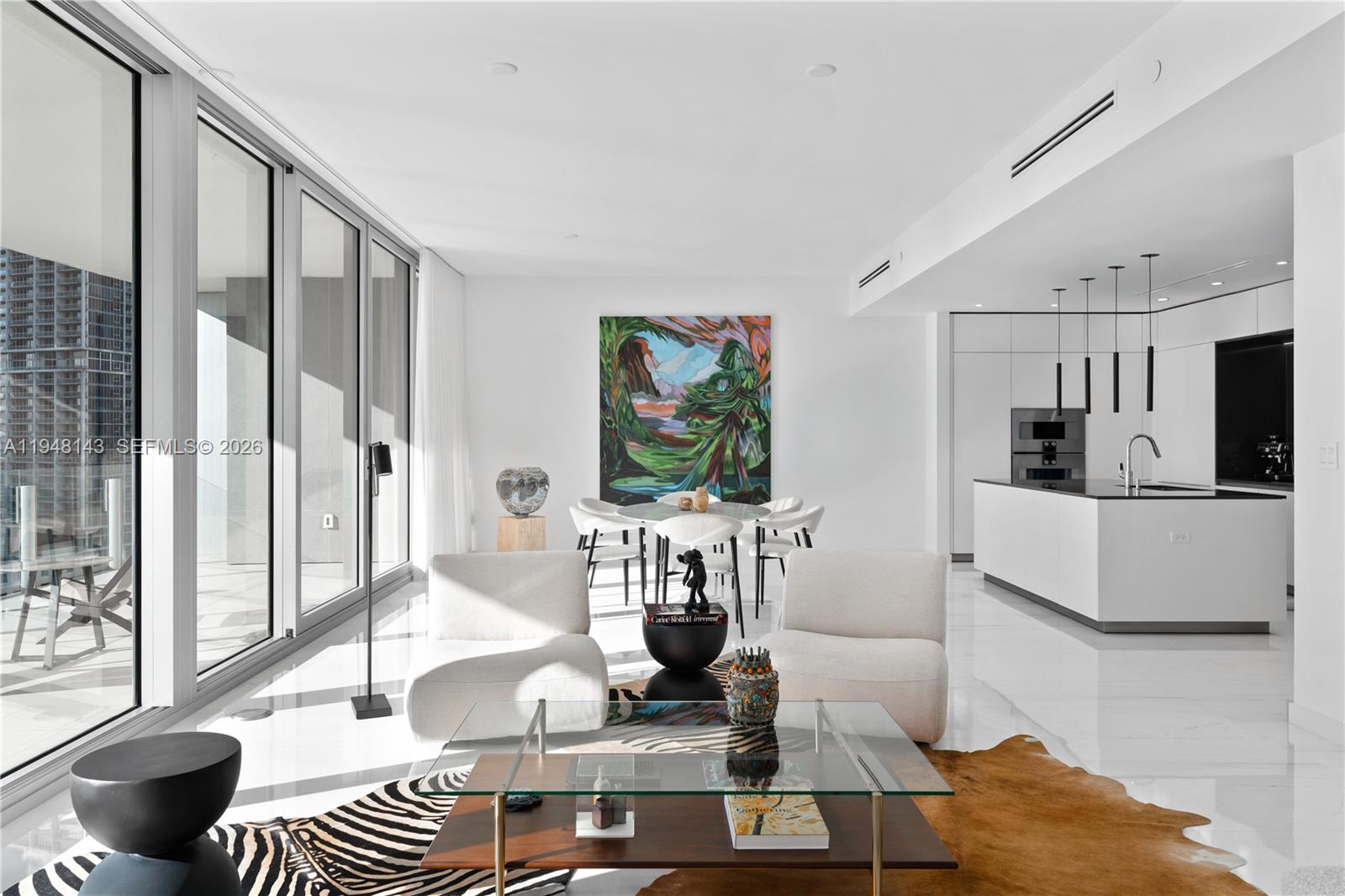 300 Biscayne Blvd Way, Unit 2102 Miami, FL 33131 - Photo 9 of 80 a living room with furniture and a flat screen tv