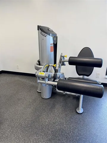 a room with gym equipment and a large window