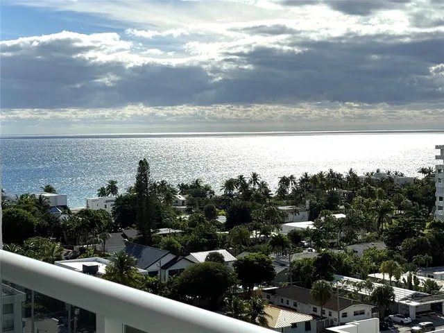 a view of a city and ocean