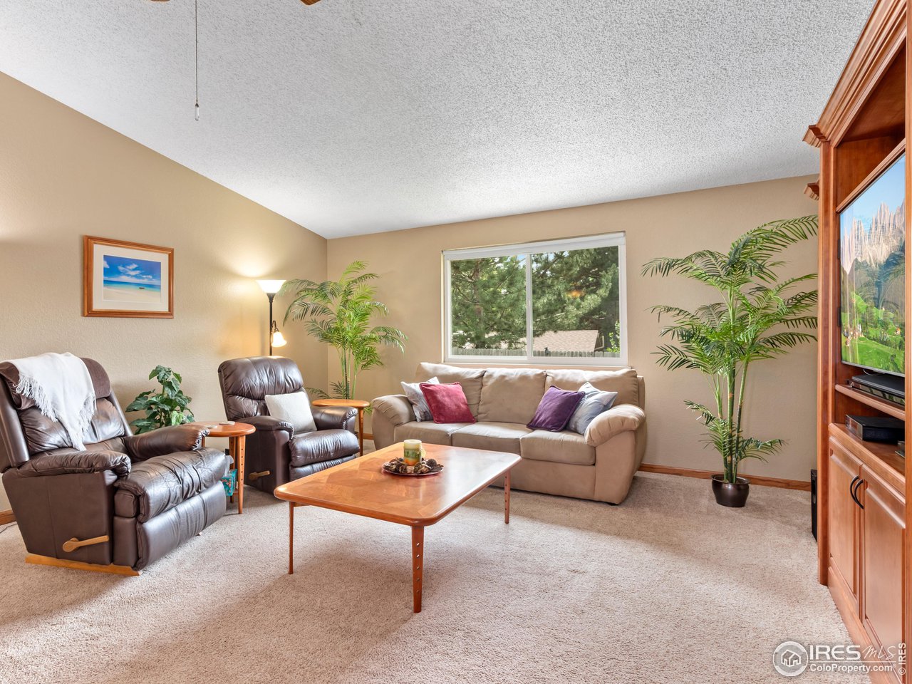 7760 Durham Way Boulder, CO 80301 - Photo 18 of 33 a living room with furniture and a large window