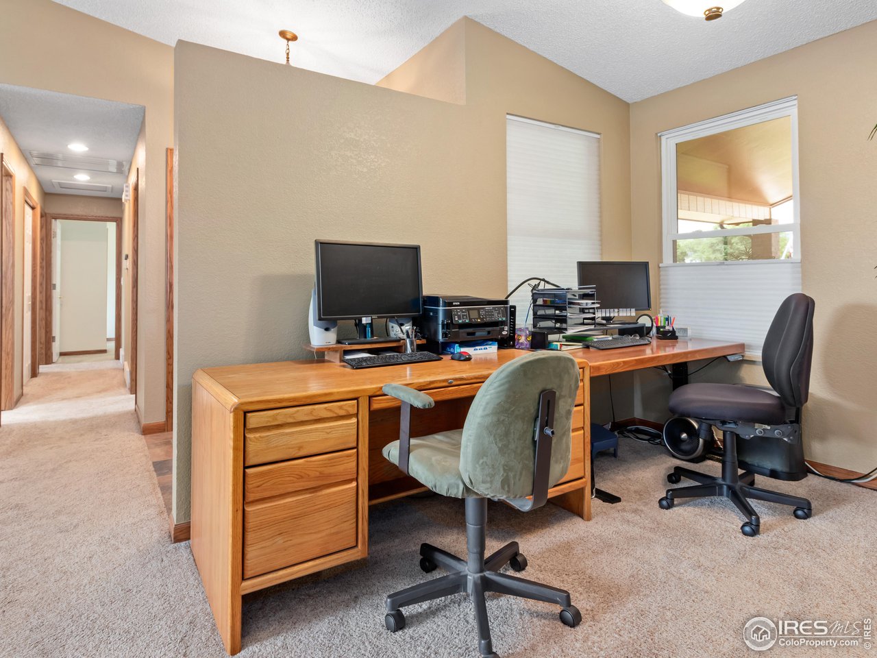 7760 Durham Way Boulder, CO 80301 - Photo 20 of 33 a view of a workspace with furniture and a window