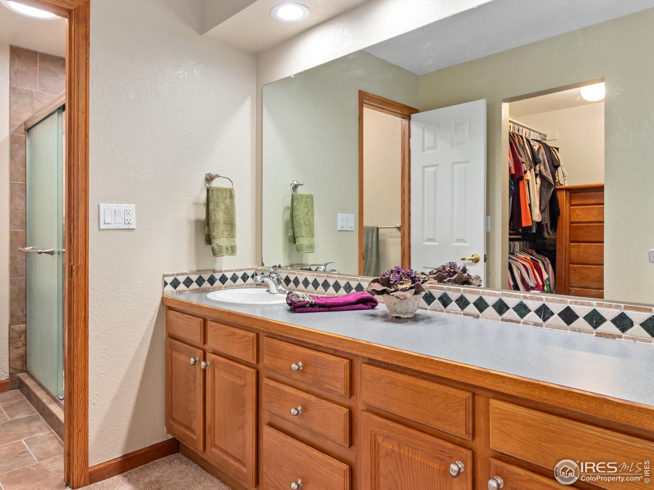 7760 Durham Way Boulder, CO 80301 - Photo 23 of 33 a bathroom with a double vanity sink mirror and