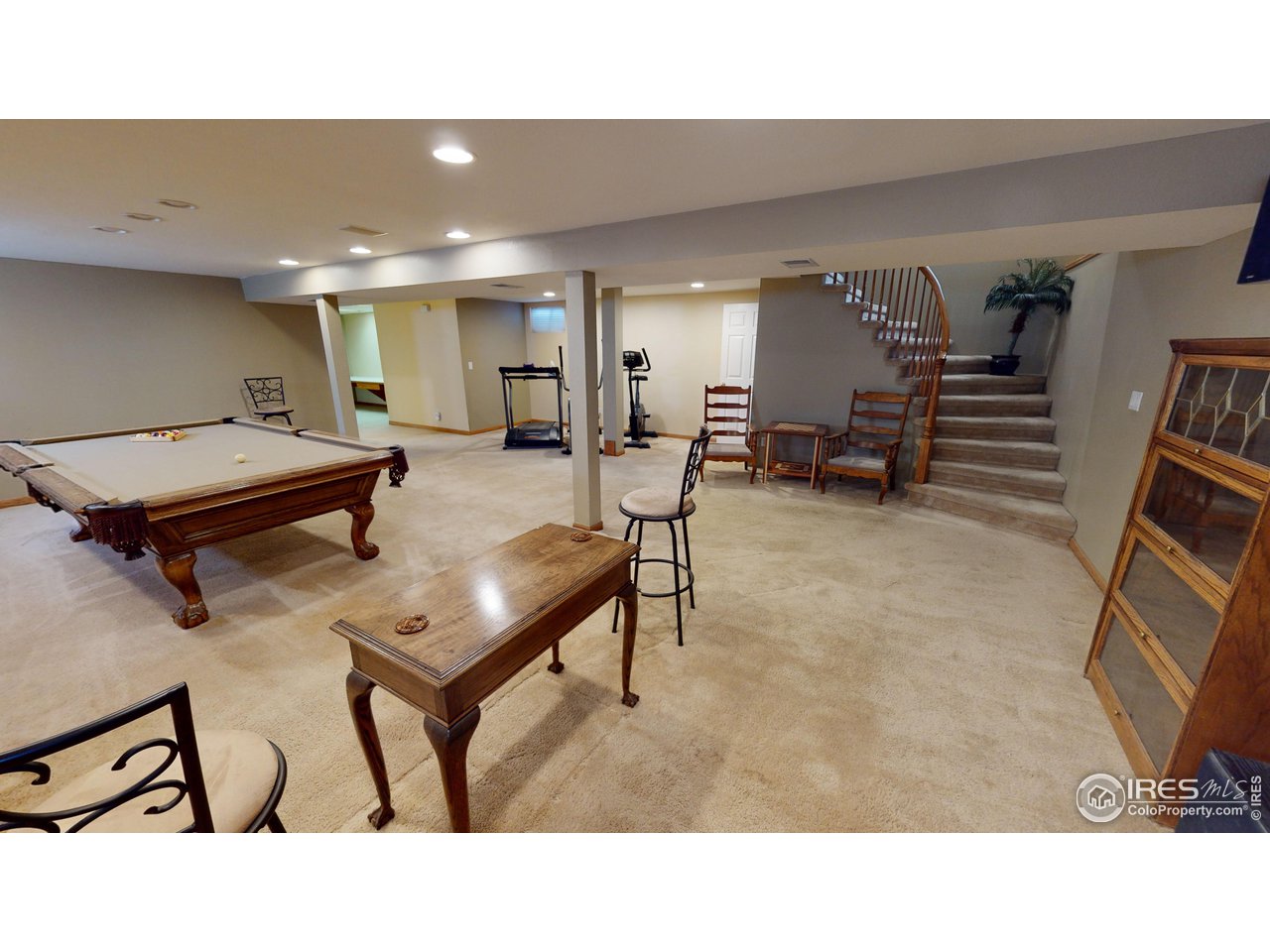 7760 Durham Way Boulder, CO 80301 - Photo 27 of 33 a room with furniture and wooden floor