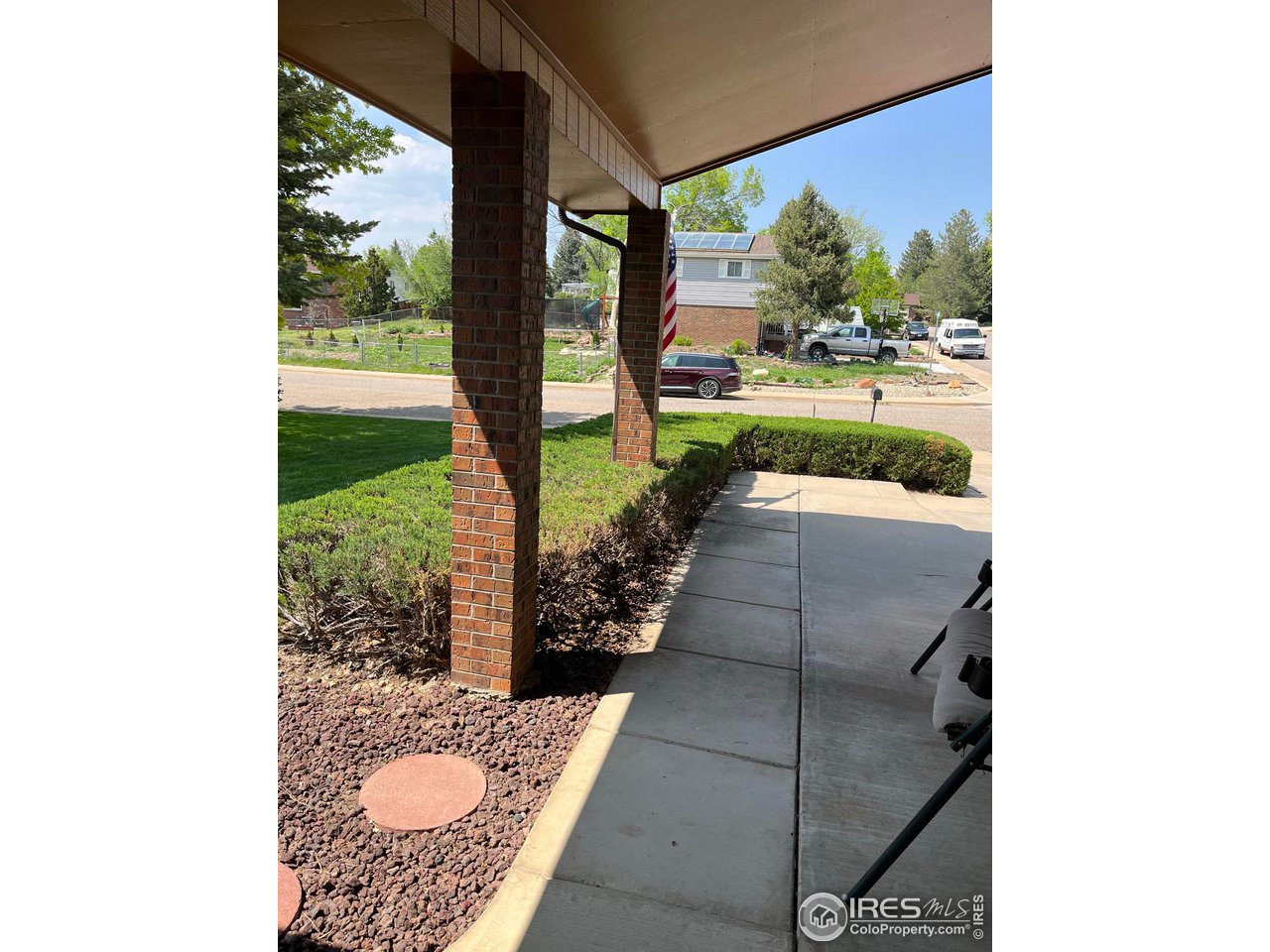 7760 Durham Way Boulder, CO 80301 - Photo 3 of 33 a view of a porch with furniture and garden