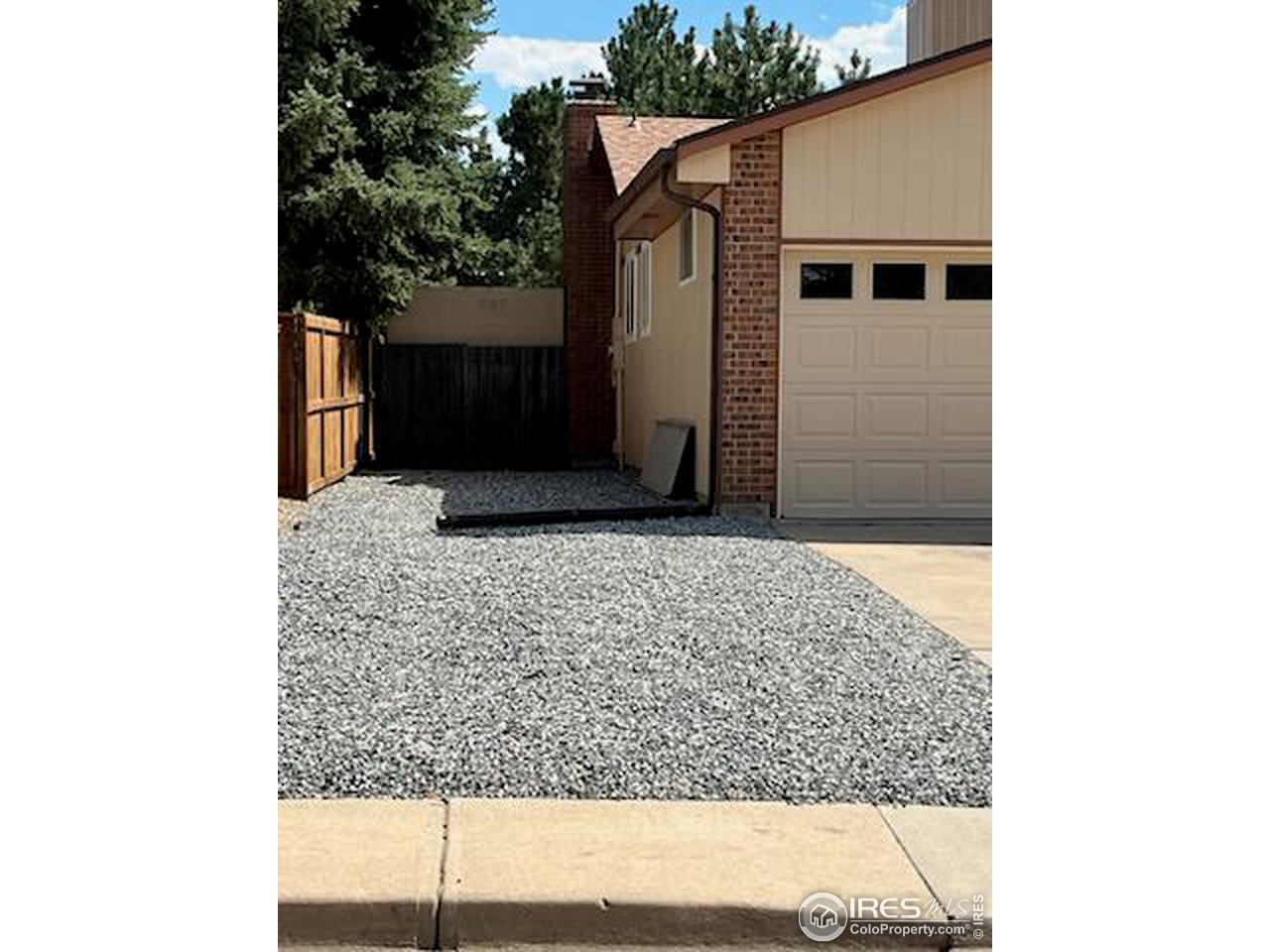 7760 Durham Way Boulder, CO 80301 - Photo 6 of 33 a front view of a house with a yard