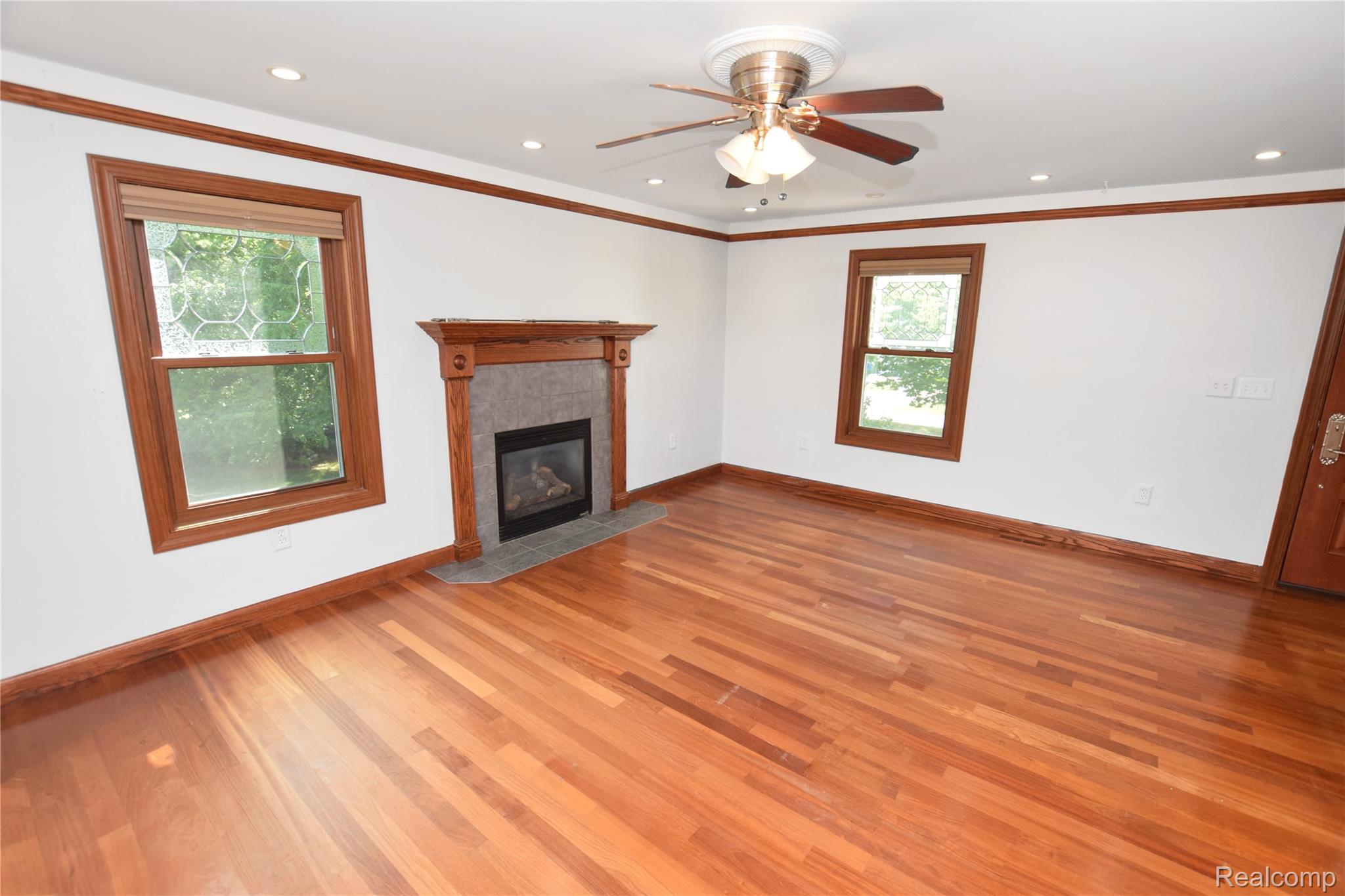 2182 Wiggins Road Fenton, MI 48430 - Photo 9 of 30 Primary Bedroom with Fireplace
