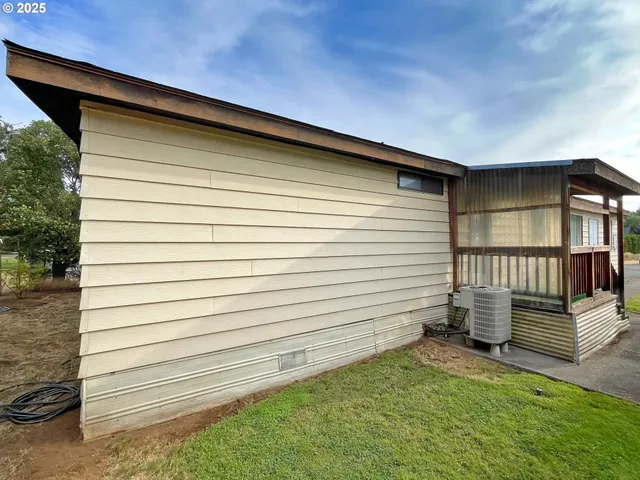 a view of a backyard with sitting area
