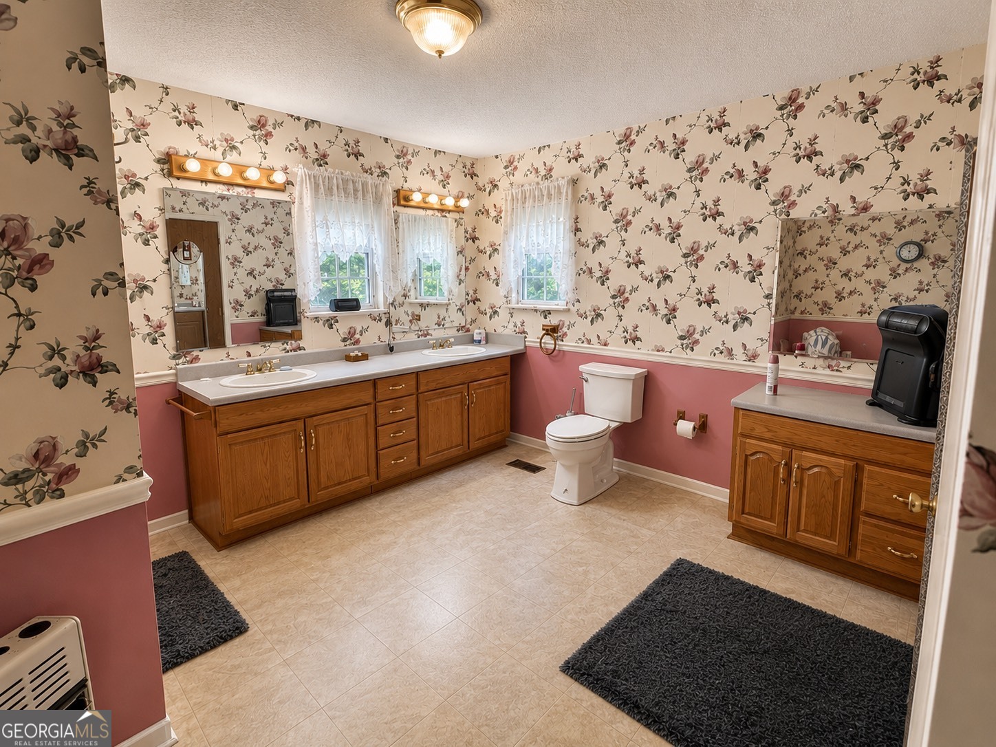 839 Cannafax Road Barnesville, GA 30204 - Photo 5 of 10 a room with cabinets a sink and a mirror
