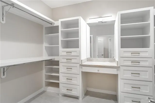 a view of an empty walk in closet